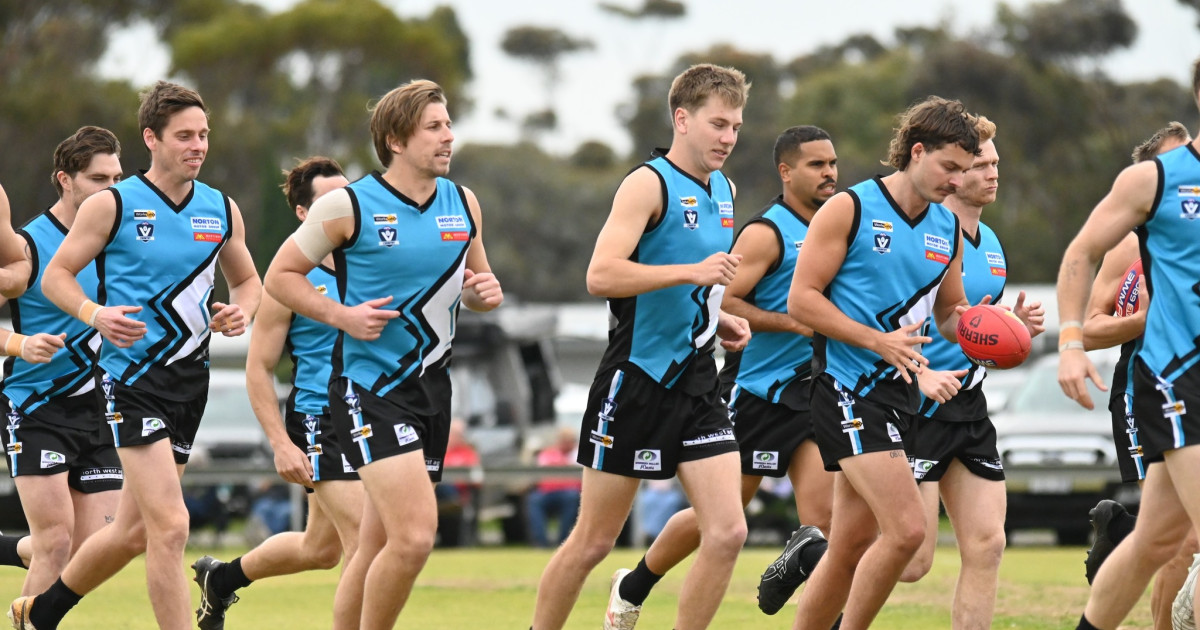 An amateur football team running a warm-up lap