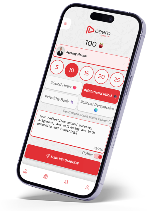 A phone showing a recognition being sent to Jeremy House, tagged with the school values Good Heart and Balanced Mind
